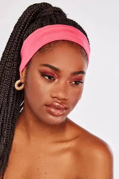 Model wearing a pink WOW head band