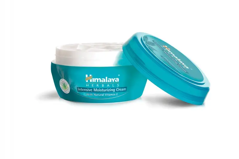 Angled view of open Himalaya Herbals Intensive Moisturizing Cream jar 150 ml