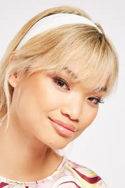 Model wearing white WOW headband